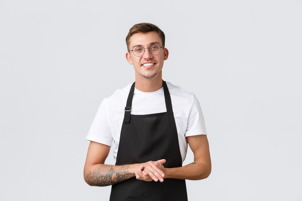 portrait d'un homme portant un tablier de cuisine noir